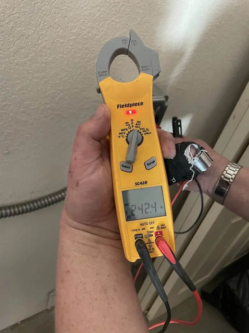 Voltage testing with clamp meter during Outlet Installation in Fort Oglethorpe